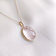 This stunning Pendant is set in 14k Solid Yellow Gold with Natural Morganite with utmost precision. It is a unique gemstone Pendant for nearly every occasion and is completely hassle-free jewelry. ITEM DETAILS: * Gem: Morganite * Gem Size: 15X19mm * Gem Shape: Oval * Gem Weight: 18.94 carats * Gold Purity: 14KT * Gold Weight: 0.65 gram * Total Weight of the Pendant: 4.44 gram The Gold purity is guaranteed and it comes with authentic 14KT gold hallmark. Since my items are handmade, they are absolutely nickel and lead free. CUSTOMIZATION: * Gemstone customization is available and it can be substituted with a gem of your choice. Kindly message me for the same. PACKAGING * The Pendant comes with layers of safe and secure wrapping along with Free handmade jewelry box with every purchase. ➡️Head Formal Yellow Gold Morganite Jewelry, Luxury Round Birthstone Gemstones, Gold Briolette Gemstones For Gift, Luxury Morganite Gemstone Jewelry, Luxury Birthstone Gemstones, Fine Jewelry Natural Stones Gemstones For Anniversary, 14k Gold Wedding Gemstones With Birthstone, Yellow Gold Jewelry With Round Natural Stones, Rose Quartz Gemstone Necklaces For Weddings