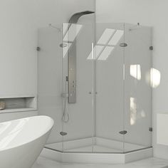 a white bath tub sitting next to a walk in shower