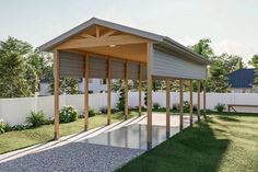 an outdoor covered area with benches and grass