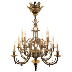 an antique chandelier with many lit candles