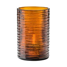 an orange glass vase sitting on top of a white table