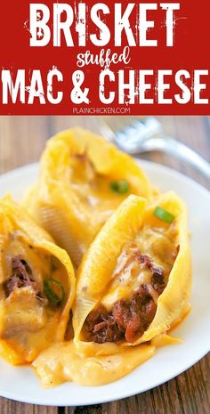 two stuffed shells with meat and cheese on a white plate, next to a fork