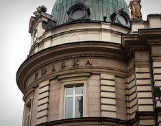 an old building with a statue on top