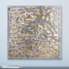 an abstract metal art piece on the wall