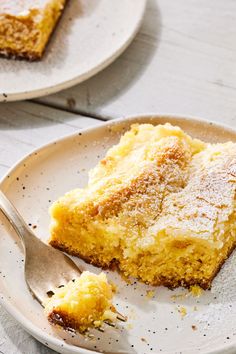 there is a piece of cake on the plate with a fork in front of it