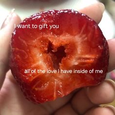 a person holding a piece of fruit in their hand that says, i want to gift you all of the love i have inside of me