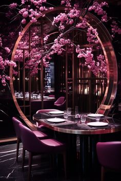 a round table with purple chairs and pink flowers in the center is surrounded by mirrors