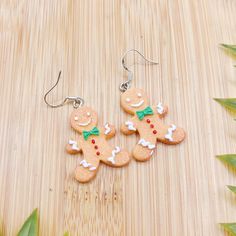 I T E M * D E S C R I P T I O N  🍪cute gingerbread man christmas cookie dangle earrings  -925 sterling silver hypoallergenic hooks or hoops  -1.5 inch drop length  -a perfect gift for a baker friend, as a stocking stuffer, or for mom!  ---------------------------------------------- Check out our other earrings here:  https://needfulthingsthrift.etsy.com?section_id=46781030 Check out our homepage here:  https://needfulthingsthrift.etsy.com M A T E R I A L S frosted gingerbread cookie pendants, 9 Christmas Cookie Earrings, Gingerbread Clay Earrings, Polymer Gingerbread Man, Polymer Clay Gingerbread Man Earrings, Gingerbread Man Earrings, Holiday Party Jewelry, Jewellery Advent Calendar, Gifts For A Baker, Food Accessories