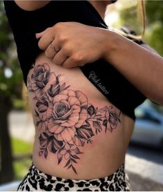 a woman's stomach with flowers on it