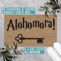 a door mat with the words alohora on it and an image of a key