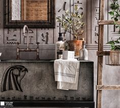 a bathroom with a sink, mirror and towel rack on the wall next to it