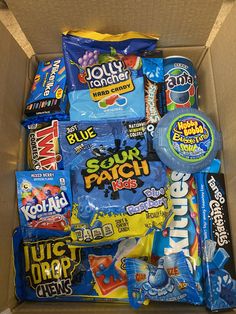 a box filled with lots of different types of candy and snacks in it's wrapper