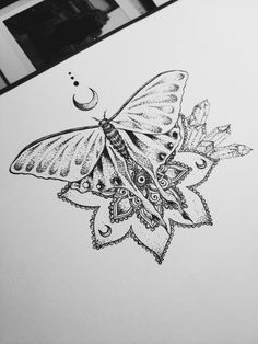 a black and white drawing of a butterfly