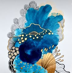 a blue and gold peacock with feathers on it's back, in front of a white background