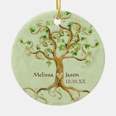 a personalized ceramic ornament with a tree and heart on the front side