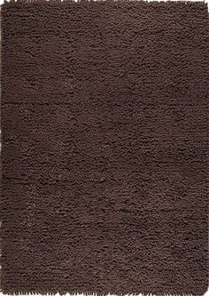 a brown area rug with fringes on it