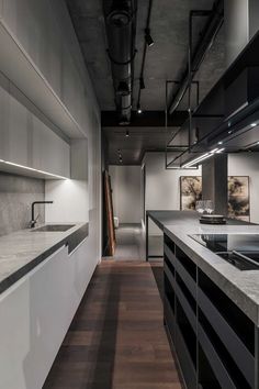 an empty kitchen with white cabinets and counter tops