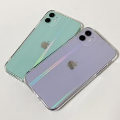 two iphones sitting next to each other on a white surface with the same color