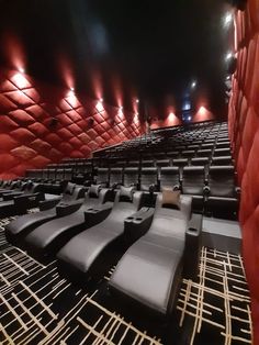 an empty theater with rows of seats