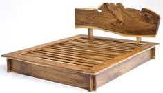 a bed frame made out of wood with no headboard or foot board on it