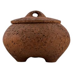 a brown ceramic jar with a handle on the front and side, isolated against a white background