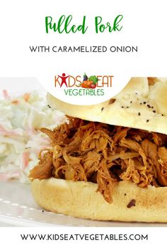 pulled pork sandwich with caramelized onion and vegetables on a white plate next to coleslaw