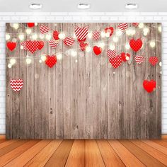 a wooden wall with red and white hearts hanging from it