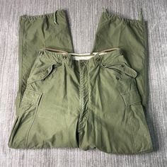 Vintage 50s US Army Military Field M 1951 Multiple Pocket Basic Essential Green Cargo Trouser Pants 34 Waist Mens Condition:  Excellent Used Condition  = No Flaws Measurements: Please see photos above for all measurements IF YOU BUY TWO OR MORE ITEMS USE THE CODE BUNDLE @ CHECK TO SAVE 20% WE SHIP WITHIN 24 HOURS AFTER PURCHASE! Please be aware that we do not offer free returns!! The Buyer is responsible for the cost of the return label. Follow us on TikTok & Instagram @findsnostalgic and tag us Retro Khaki Bottoms With Pockets, Vintage Cargo Pants With Cargo Pockets For Outdoor, Retro Full-length Cargo Pants With Pockets, Retro Full Length Cargo Pants With Pockets, Vintage Green Cargo Pants With Pockets, Vintage Cargo Pants With Side Pockets, Vintage Khaki Full-length Cargo Pants, Vintage Full-length Khaki Cargo Pants, Vintage Outdoor Bottoms With Cargo Pockets