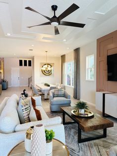 a living room filled with furniture and a flat screen tv