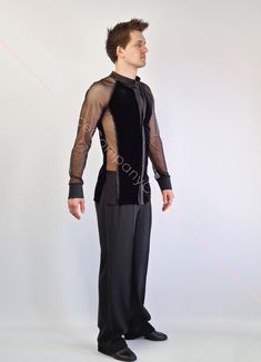 a man in black pants and sheer shirt