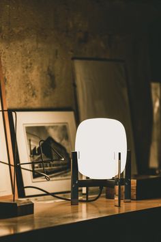 Designed by Miguel Mila, the Cestita Metalic Table Lamp is a study in contrast. Severe metal brackets support a delicate opal globe diffuser. Akari Light, Light Sculptures, Spain Design, Santa Cole, Modern Ceiling Lamps, Table Lamps Living Room, Small Table Lamp, Metal Baskets, Light Sculpture