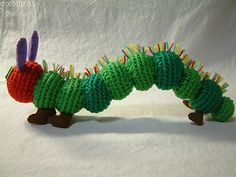 the very hungry caterpillar is crocheted in green and red