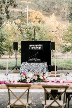 a table set up for an outdoor wedding