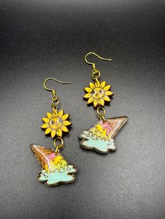 Handmade ice cream and sunflower dangle earrings. Cute and colorful jewelry, unique artisan gift for her. Perfect summer accessory, fun kawaii earrings to add a playful touch to any outfit. Made out of wood, hand painted with acrylics and topped with resin. Check out my other listings: etcheloquence.etsy.com Novelty Multicolor Dangle Jewelry, Multicolor Novelty Dangle Jewelry, Summer Gift Jewelry With Sunflower Design, Sunflower Design Dangle Earrings For Gift, Sunflower Design Dangle Earrings As Gift, Fun Multicolor Jewelry For Crafting, Yellow Whimsical Dangle Earrings, Novelty Summer Jewelry Gift, Whimsical Yellow Dangle Earrings