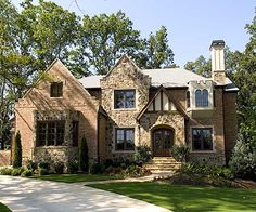 a large brick house with lots of windows