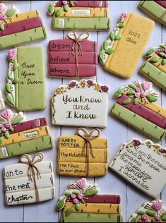 decorated cookies are arranged on a table for someone's special occasion to be served