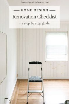 a step ladder in the middle of a room with white walls and wood flooring