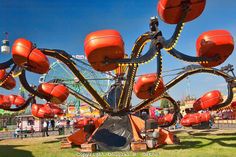 an amusement park with many red balls on it