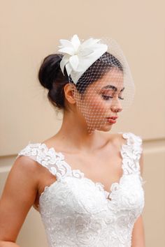 Such a classic and elegant  lilies symbolize purity and innocence. Composed of one artificial lily with, these blooms are perfect for every event. Our all product are handmade.Plastic split hair comb is included in the its midst  and one artificial flower on top.This chic wedding hat is emphasized with delicate french veiling around the hat. All make with wool felt in creamy white/ecru color. Our all products are handiwork with delicately. Please feel free to contact with me for more information about our products. Your all orders will be ready to shipped in 1-2 working days. With my best wishes Headpiece With Veil, Bridal Party Hats, Mini Hats, Easter Hat, Fascinator Wedding, Short Veil, Unique Hair Accessories, Bridal Fascinator, Bride Hat