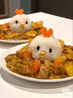 two white plates topped with rice covered in chicken and veggies next to each other