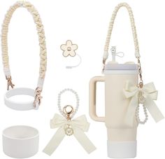 a set of accessories including a coffee mug, bracelets and ring holder with bows