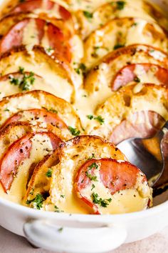 a casserole dish with ham and cheese