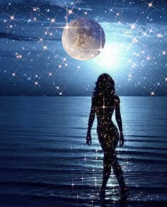 a woman is standing in the water with her back to the camera and stars above her head