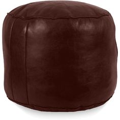 a brown leather poufce sitting on top of a white floor