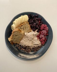 a blue plate topped with different types of food on top of a white countertop