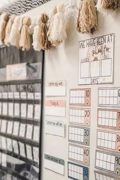 a bulletin board with tassels hanging on it and the words, 100 days at school