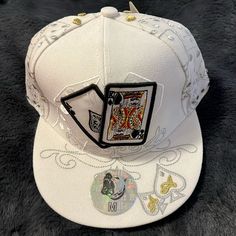 Silver And Gold Embroidered Dice On Cap. Ace King Poker Hands On The Front And On The Back. Pitbull Brand. Get Lucky On Your Next Poker, Blackjack, Or Casino Trip!!! Trendy White Baseball Cap With Short Brim, White Casual Snapback Hat With Short Brim, Casual White Snapback Hat With Short Brim, Trendy White Embroidered Hat, White Hip Hop Baseball Cap, One Size Fits Most, Embroidered White Baseball Cap For Streetwear, White Embroidered Baseball Cap For Streetwear, Hip Hop Style White Baseball Cap, White Embroidered Logo Hat One Size