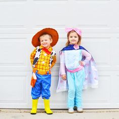 two children dressed up as toy story characters standing in front of a garage door with their arms around each other