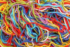 many different colored ropes are piled together