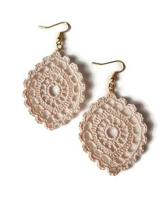 two pairs of earrings with white crocheted doily and gold earwires